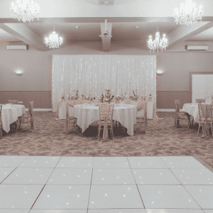 Elegant banquet hall with chandeliers and luxurious decor at The Ro Hotel.