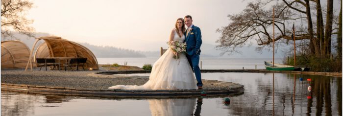 Elegant wedding couple by the lake at The Ro Hotel, scenic waterfront wedding venue in Oregon.