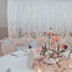 Elegant banquet setup with floral centerpieces at The Ro Hotel’s special event space.