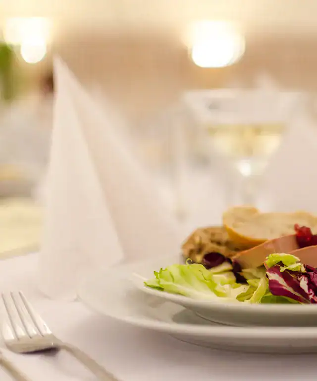 Delicious gourmet salad served at The Ro Hotel, perfect for a luxurious dining experience.