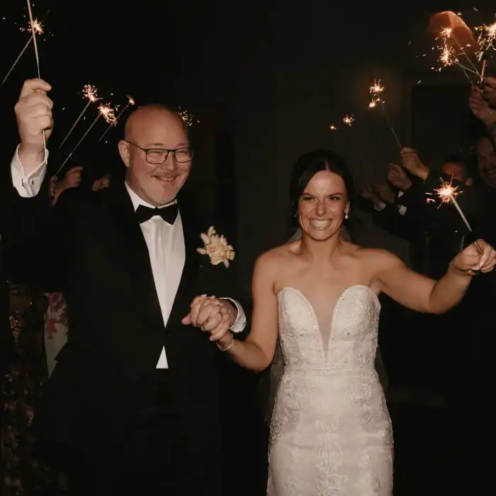 Bespoke wedding celebration at The Ro Hotel with sparklers and joyful moments.