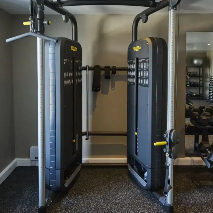 Modern gym equipment at The Ro Hotel fitness center for guest wellness and exercise needs.