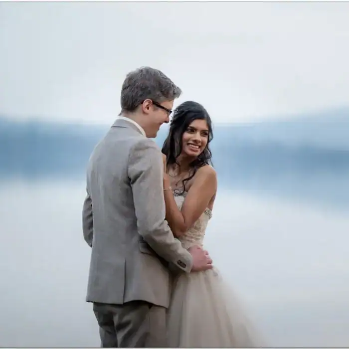 Elegant couple enjoying romantic moment at The Ro Hotel waterfront wedding venue.