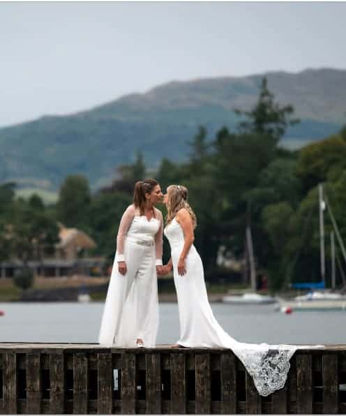 Elegant wedding photographers capturing brides in white dresses at The Ro Hotel waterfront.