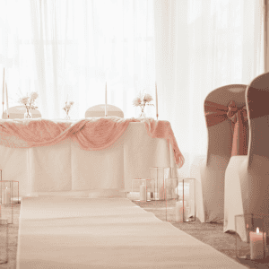 Elegant hotel banquet setup with soft lighting and floral decor at The Ro Hotel.