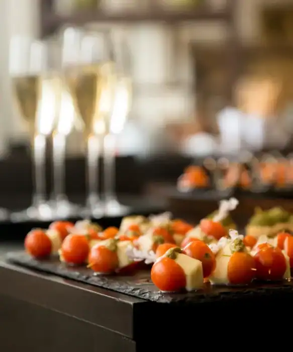 Delicious caprese skewers with cherry tomatoes, mozzarella, and basil at The Ro Hotel.
